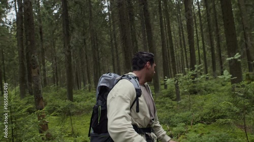 Wallpaper Mural Handheld shot of young multiethnic man wearing hiking equipment lost in forest shouting for help during outdoor adventure Torontodigital.ca
