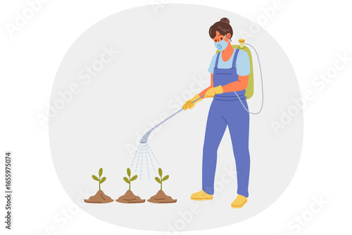 Woman gardener sprays weedkiller and pesticides on plants to speed up growth and kill insects or pests. Girl farmer uses dangerous chemical-based weedkiller to grow fruits or vegetables