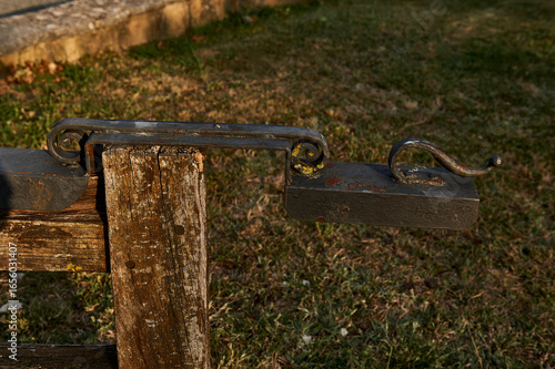 Fotografie wrought iron gate to close a wooden door on a property