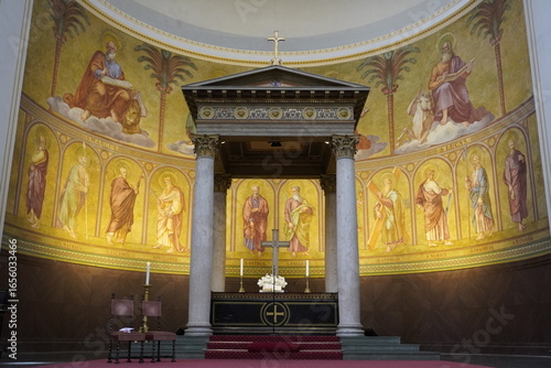 A beautiful devotional gold and marble altar with historic paintings of the Twelve Apostles is the landmark attraction inside St. Nicholas' Church (Nikolaikirche), Potsdam, Brandenburg, Germany