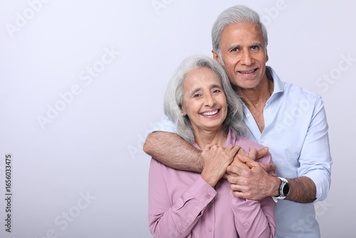 A Lovely Couple Sharing A Joyful Moment In A Studio Setting