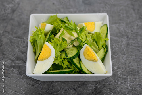 salad greens cucumber and boiled egg