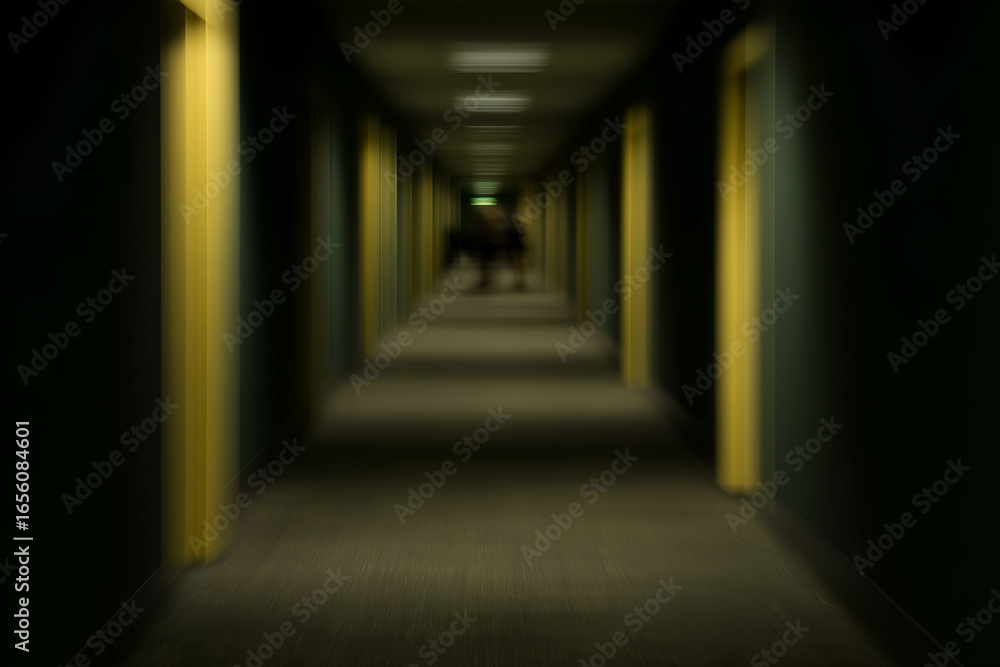 Fototapeta premium Blurred Figure Walking Down Long Dark Hotel Hallway With Yellow Door Frames, motion blur Business concept, motion bokeh background