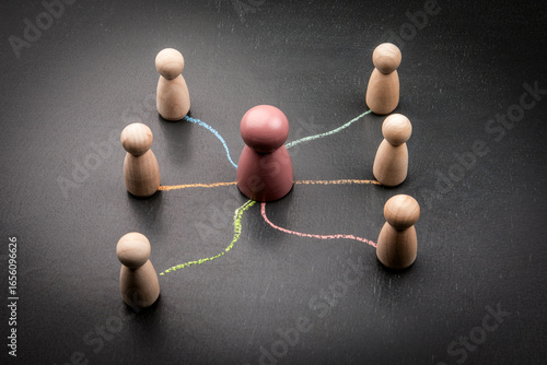 Fotografia Leadership and team connection concept with central figure and communication lin