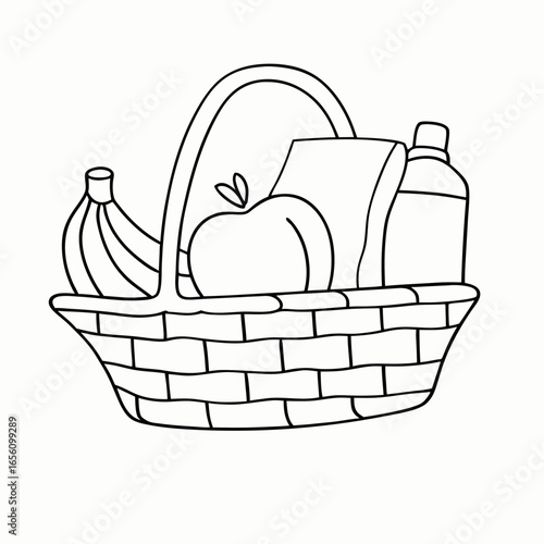 Wicker basket with fruit paper towels and bottle for picnic or kitchen storage with copy space for harvest festival