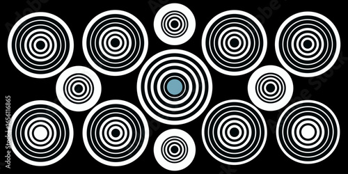 A collection of twelve circular graphic elements, set against a black background. Each element is composed of radiating, concentric, thin, white lines forming various circular and spiral patterns. Som