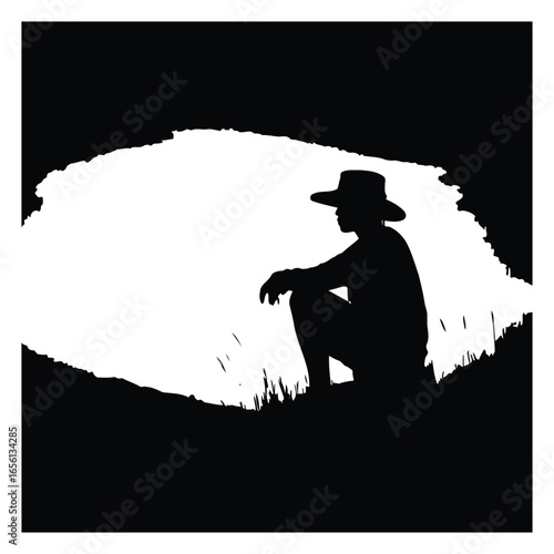 Lone figure silhouetted against a mountain landscape
