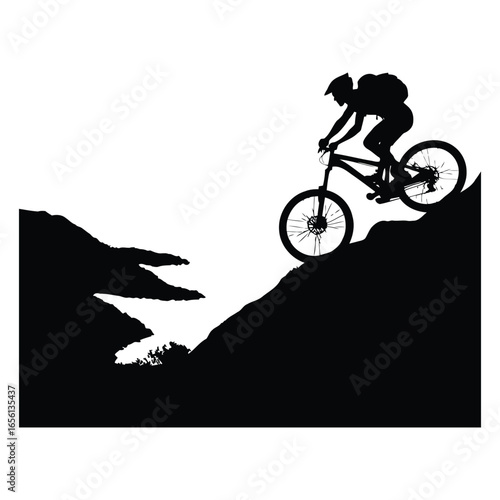 Mountain biker silhouette descending a steep trail