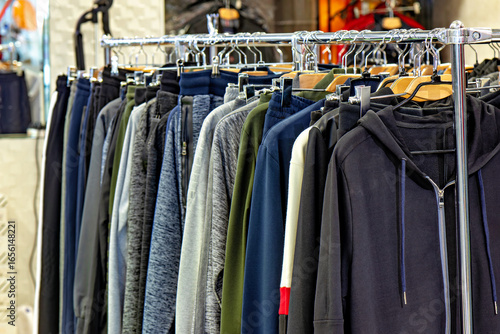 Wallpaper Mural This image shows a rack of clothing specifically a variety of jackets and sweatshirts Torontodigital.ca