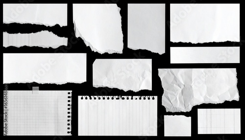 Torn and crumpled paper scraps, black background