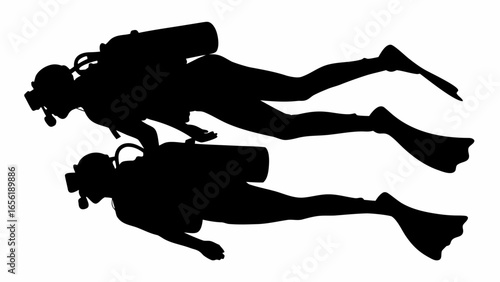 Silhouette of two scuba divers swimming underwater with diving gear and flippers in a monochrome image