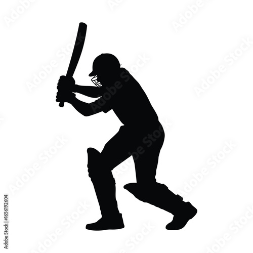 Silhouette of a cricket batsman in action ready to hit the ball