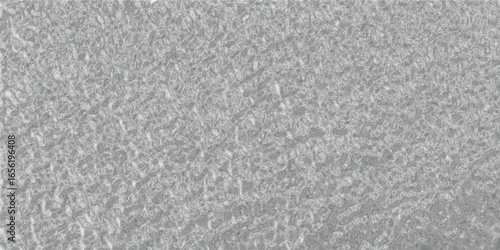 Textured grayscale background with granular surface ideal for abstract designs digital backgrounds and artistic templates.