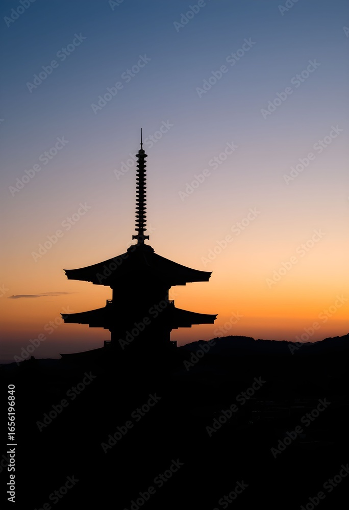 Silhouette of a traditional Japanese pagoda against a vibrant sunset sky. Silhouette of a traditional Japanese pagoda against a vibrant sunset sky.