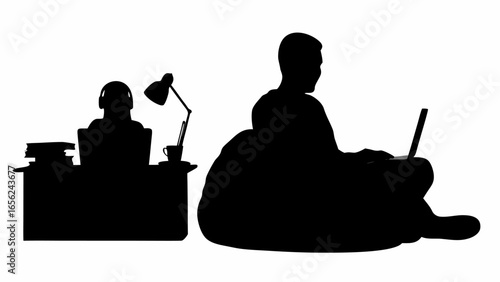 Silhouette of two people working on laptops at desks with books and a lamp in a home office setting