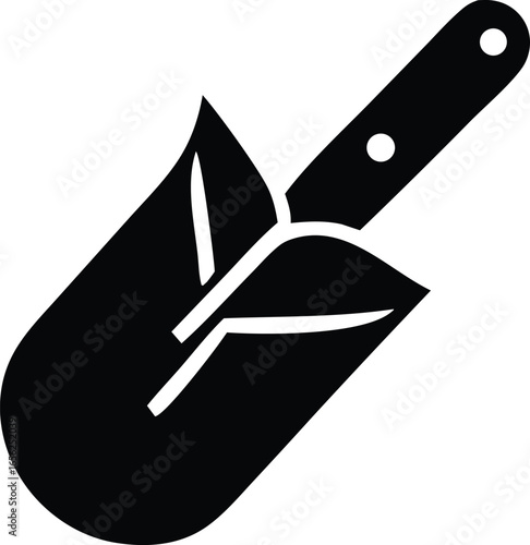 A stark black and white silhouette of a garden trowel a classic gardening tool angled diagonally with a simple handle