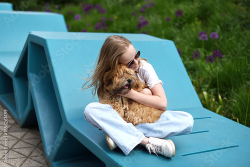 Little Girl in City Park Walking Playing with her Havanese Bichon-type Dog Seasonal Summer