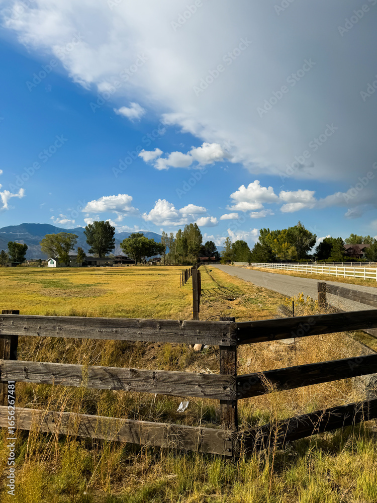 Fototapeta premium Old ranch near town Gardnerville Nevada USA, ranch with fence during daytime against blue sky. High quality photo