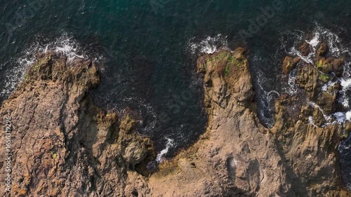Stunning Aerial View of Waves Crashing on Rocks – Epic 4K Slow Motion