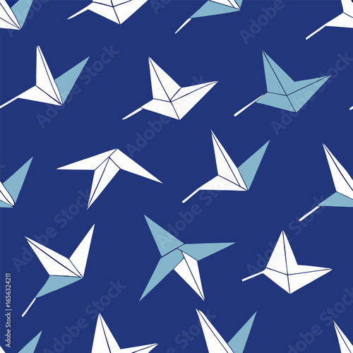 Charming seamless pattern featuring a repeating layout of colorful origami paper cranes