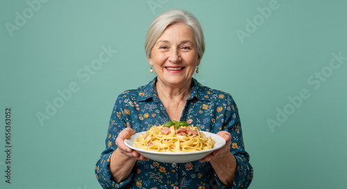 Senior Woman Serving Delicious Pasta Carbonara