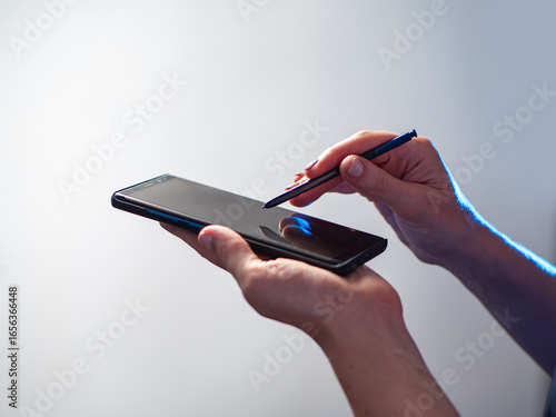 Smartphone with stylus in h...