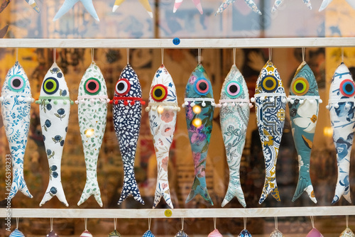 Decorative small fabric fishes in the souvenir shop window in Porto, Portugal