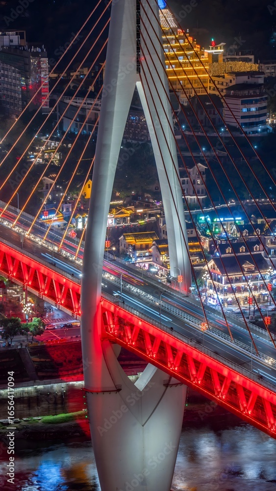 Obraz premium Aerial Night View of Illuminated Bridge and Urban Skyline in Chongqing China with Vibrant City Lights