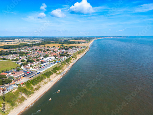 Wallpaper Mural UAV view of a sunny Norfolk, UK coastline in early August. Holiday chalets and a resort can be seen near the cliff edge. Torontodigital.ca