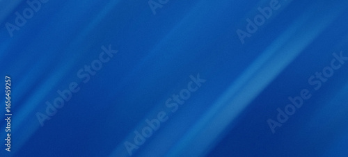 Abstract blue background with diagonal streaks of light