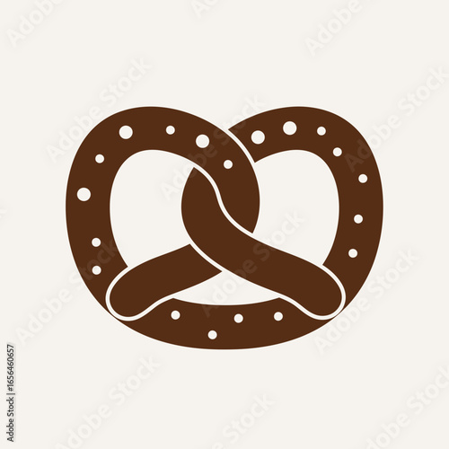 A brown pretzel with salt crystals on a light background.