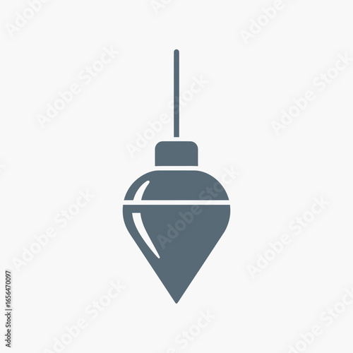 A plumb bob hangs against a white background.