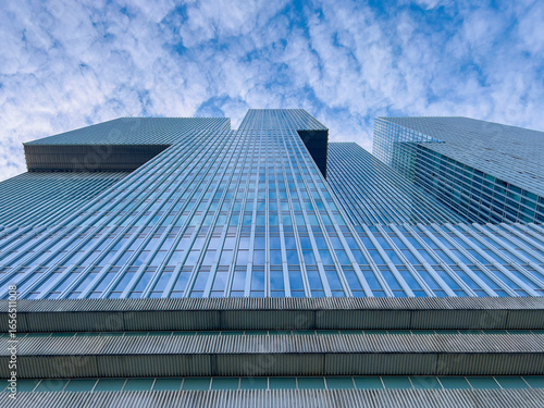 Iconic towers rise dramatically against a vast sky, their stacked, modernist volumes creating a striking silhouette that captures the city’s innovative architectural spirit and dynamic skyline.