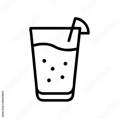 Refreshing drink in tall glass with straw and lemon slice  