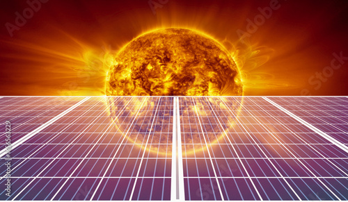 Fototapeta Naklejka Na Ścianę i Meble -  Solar panel with our star sun orange abstract background photovoltaic renewable sources green energy -  High voltage power lines 