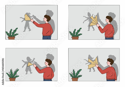 Man playfully interacts with a shadow on the wall, using a folded paper object to distort and reshape its form, showcasing creativity and imagination.