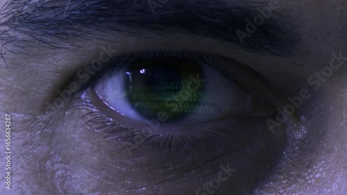 Conceptual video of Hacking and Digital Security reflected in an close-up Eye