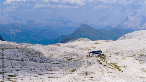 Time lapse at Cima Rosetta with a view of the refuge and the comings and goings of tourists. Pale di San Martino, Dolomites, Italy.