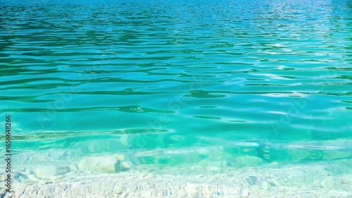 wavy surface of clear turquoise water