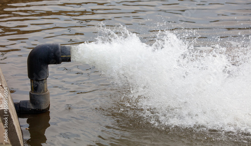 Wallpaper Mural Pipe is spraying water into the water Torontodigital.ca