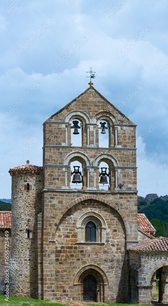 Fototapeta premium Collegiate Church of San Salvador de Cantamuda in the municipality of La Pernía in the Palencia Mountains. Province of Palencia, Castile and Leon, Spain. Europe