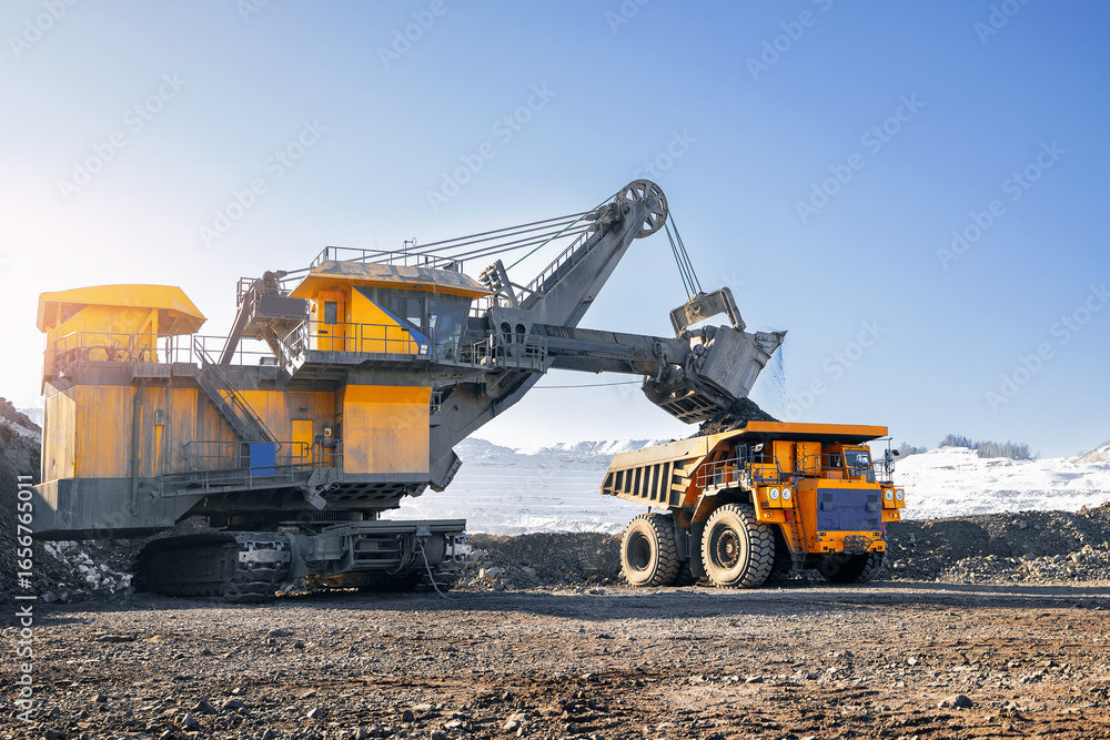 Process work on open pit mine with big truck, sunlight Process work on open pit mine with big truck, sunlight