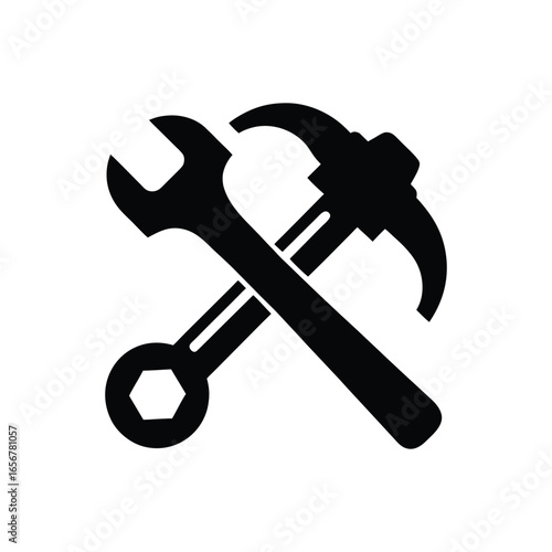 Black silhouette of a wrench and hammer crossed isolated on white background