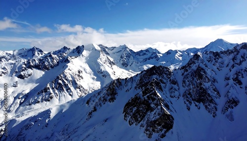 Snowy mountain peaks under a clear blue sky.