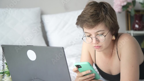 A young beauty blogger expresses authentic emotions while working and talking on the phone – from focused concentration to joyful reactions. Perfect for lifestyle and digital content