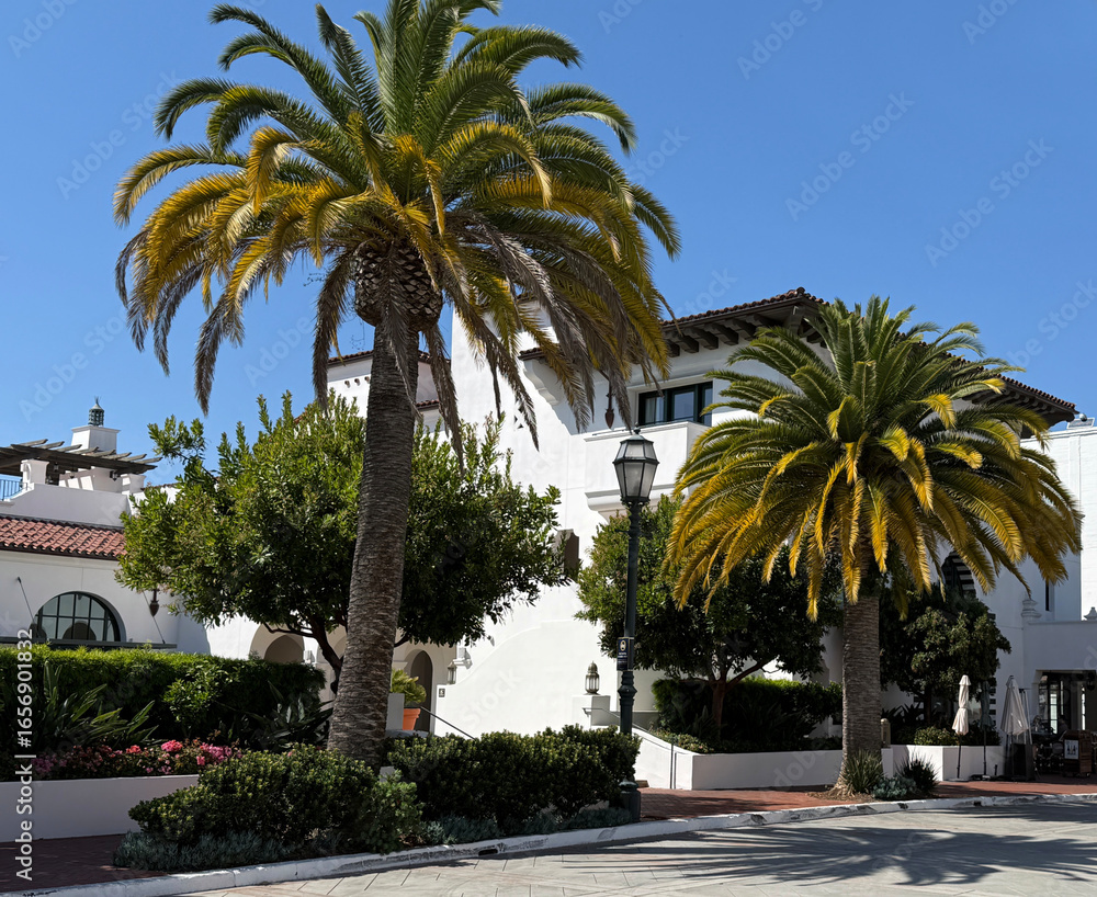 Fototapeta premium Santa Barbara downtown public parking structure in Spanish mission revival style under blue sky