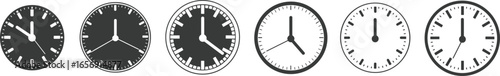 Analog wall clocks showing different times, black and white clock faces, vintage style round watches, time measurement concept illustration