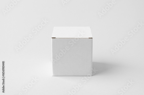 Square white cardboard box with kraft interior mockup on neutral background