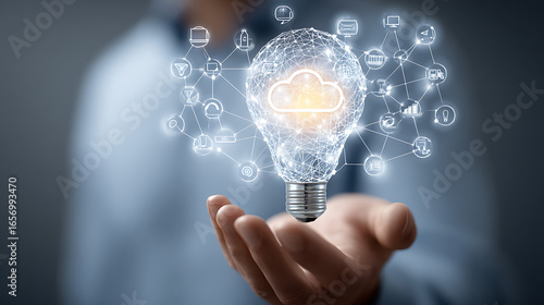 Person holding glowing lightbulb network with cloud technology innovation