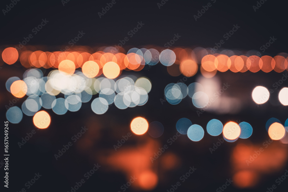 Fototapeta premium Bokeh of City Lights Behind the Night Window Glass